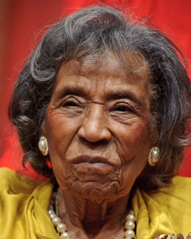 Mrs. Amelia Boynton, Integration Leader w. poster of George Wallace.  (Photo by Francis Miller//Time Life Pictures/Getty Images)